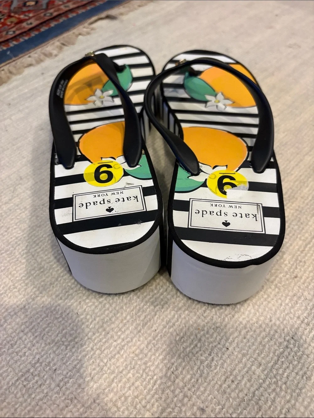 Kat’s Spade Women’s Orange Fruit Stripe Flip Flops - Black Straps